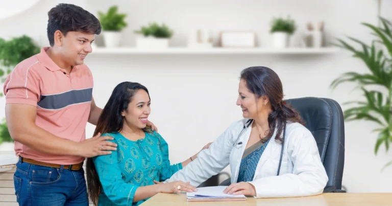 Doctor explaining IVF process step-by-step to a hopeful couple at IVF Angels Goa