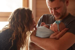 Couple holding baby after successful IVF treatment in Goa
