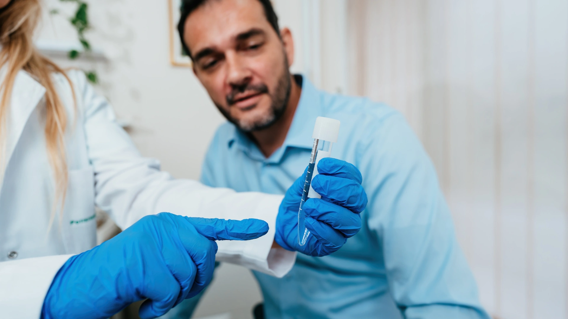 Dr. Milind Colvalcar in the IVF Angels Goa lab, reviewing DFI testing or Microfluidics sperm sorting results for a male infertility case.